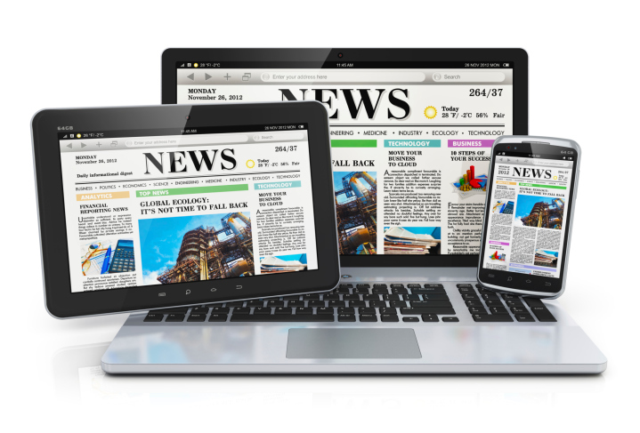 Tablet, laptop and smartphone displaying the same newspaper image.