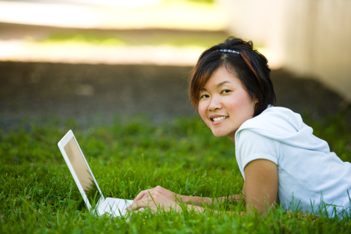 woman using laptop outdoors