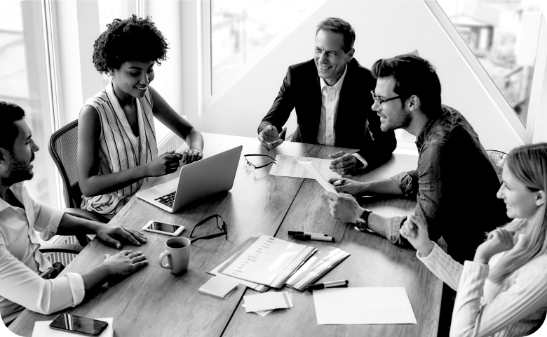 Image of a group of people in a meeting discussing recruiting resources
