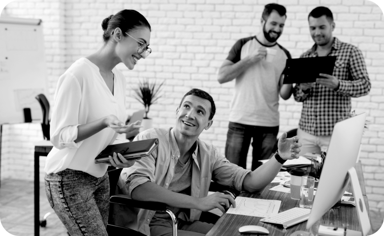 Image of a group of people reviewing their HR resources